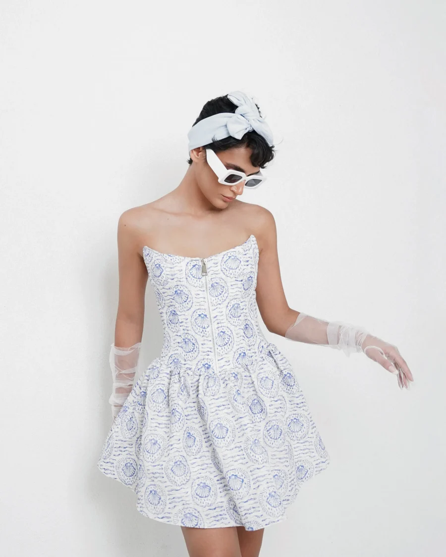 White strapless mini dress with blue seashell print